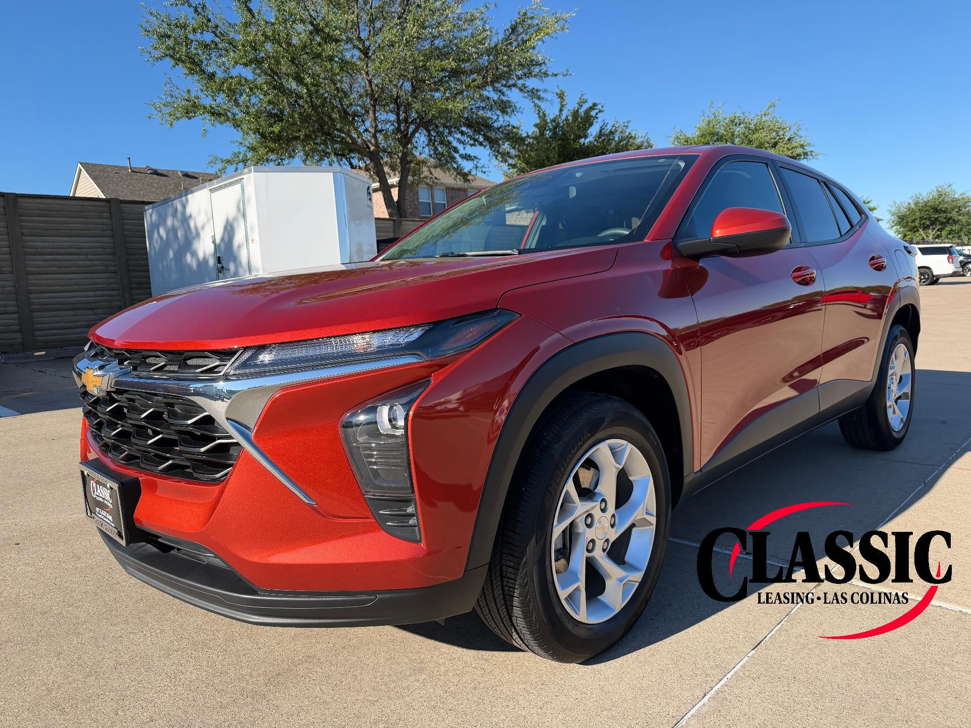 2024 Chevrolet Trax FWD 4dr LS in Cayenne Orange Metallic — front three-quarter view