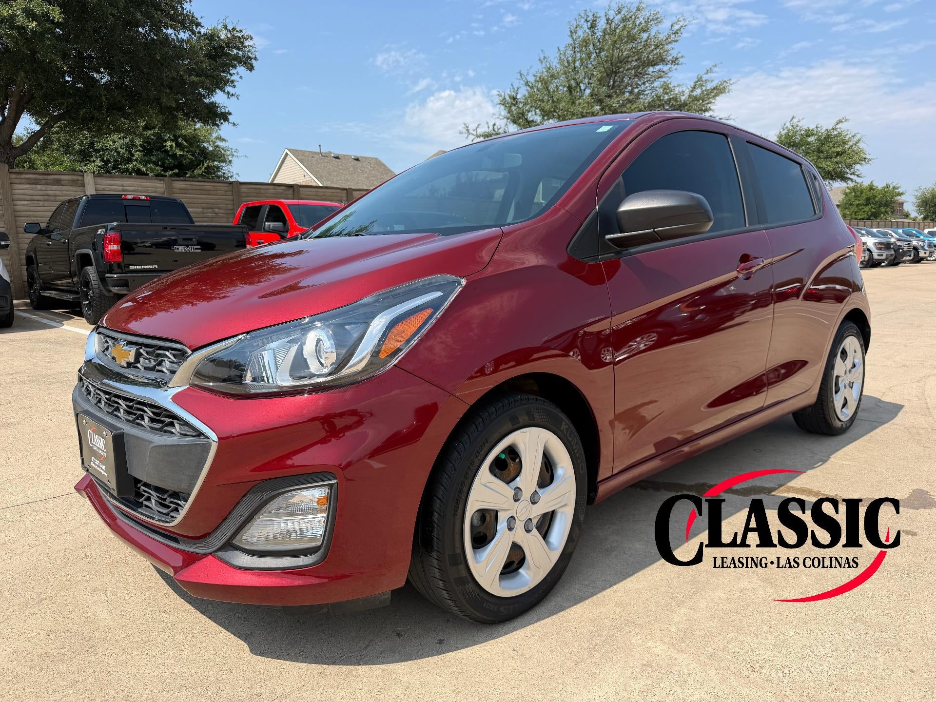 2022 Chevrolet Spark 4dr HB CVT LS in Crimson — front three-quarter view
